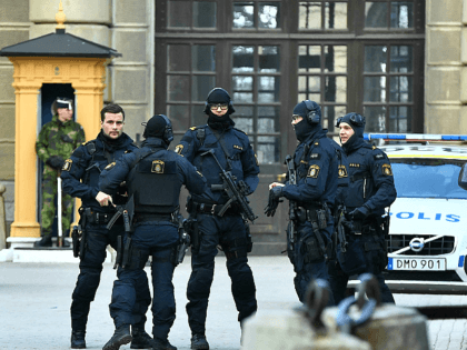 Police stand outside Stockholm Castle after a truck crashed into the Ahlens department store at Drottninggatan in central Stockholm, April 7, 2017. A truck slammed into a crowd of people outside a busy department store in central Stockholm, causing "deaths" in what the prime minister described as a "terror attack." …