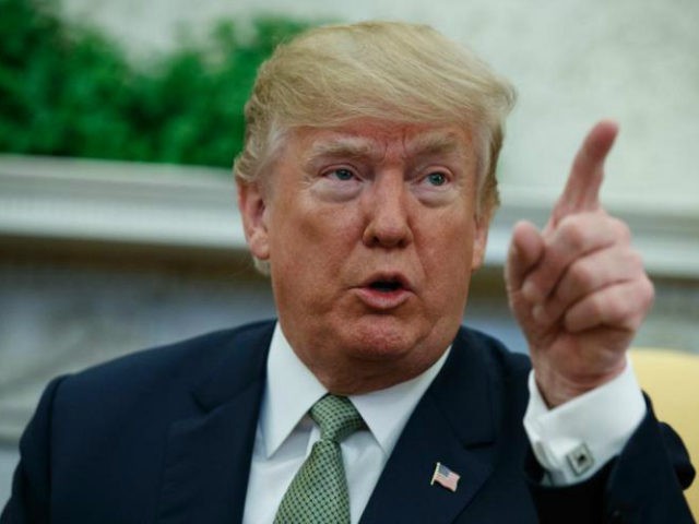 n this March 15, 2018, file photo, President Donald Trump talks with reporters in the Oval