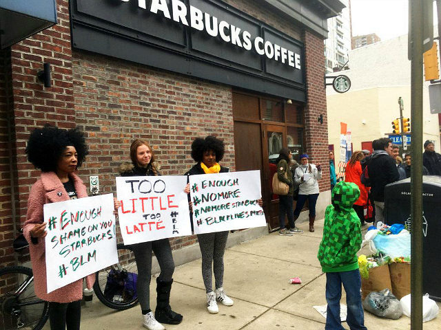 Protesters gather outside a Starbucks in Philadelphia, Sunday, April 15, 2018, where two black men were arrested Thursday after Starbucks employees called police to say the men were trespassing. The arrest prompted accusations of racism on social media. Starbucks CEO Kevin Johnson posted a lengthy statement Saturday night, calling the …