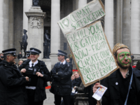 climate protest london British policemen (L) share a joke as a man protests against Climate Change, Poverty and Injustice and Suffering, outide the Royal Exchange in London, on March 31, 2009. London is bracing for angry protests before and during Thursday's G20 summit, which will see fortress-like security for world leaders including US …