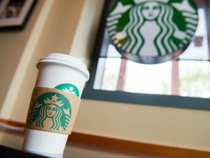 A Starbucks coffee cup is seen inside a Starbucks Coffee shop in Washington, DC, April 17,