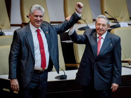 HAVANA, CUBA - APRIL 19: Former Cuban President Raul Castro raises the arm of newly elected Cuban President Miguel Diaz-Canel during the National Assembly at Convention Palace on April 19, 2018 in Havana, Cuba Diaz-Canel will be the first non-Castro Cuban president since 1976. Raul Castro steps down after 12 …