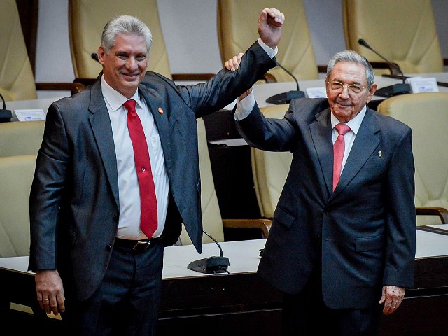 HAVANA, CUBA - APRIL 19: Former Cuban President Raul Castro raises the arm of newly elected Cuban President Miguel Diaz-Canel during the National Assembly at Convention Palace on April 19, 2018 in Havana, Cuba Diaz-Canel will be the first non-Castro Cuban president since 1976. Raul Castro steps down after 12 years in power. (AFP Adalberto Roque/Pool/Getty Images )