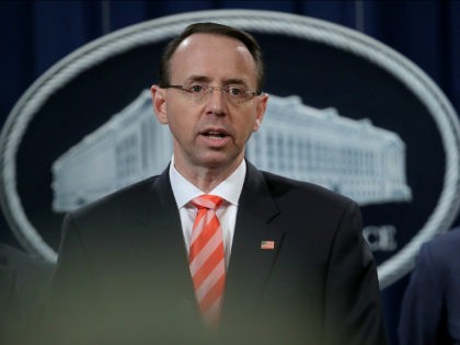 WASHINGTON, DC - MARCH 23: U.S. Deputy Attorney General Rod Rosenstein speaks at a press conference at the Department of Justice March 23, 2018 in Washington, DC. Rosenstein and other law enforcement officials announced a major cyber law enforcement action against nine Iranians charged with conducting massive cyber theft campaigns …