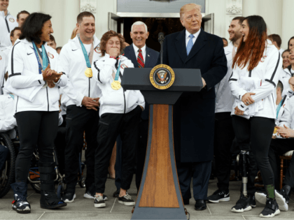 President Donald Trump jokes with Olympic snowboarding gold medalist Redmond Gerard during