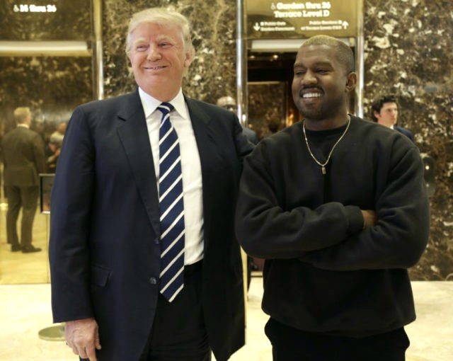 President-elect Donald Trump and Kanye West pose for a picture in the lobby of Trump Tower in New York, Tuesday, Dec. 13, 2016. (AP Photo/Seth Wenig)