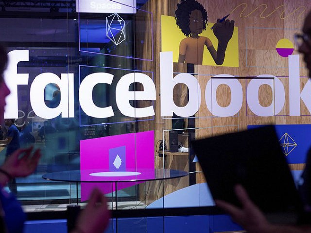 FILE - In this April 18, 2017, file photo, conference workers speak in front of a demo booth at Facebook's annual F8 developer conference, in San Jose, Calif. One of the congressional committees investigating Russia’s interference in the 2016 election has invited the tech giants Facebook, Twitter and the parent …