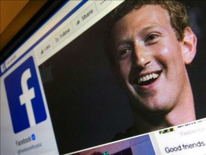 A picture taken in Moscow on March 22, 2018 shows an illustration picture of the English language version of Facebook about page featuring the face of founder and CEO Mark Zuckerberg. A public apology by Facebook chief Mark Zuckerberg, on March 22, 2018 failed to quell outrage over the hijacking …