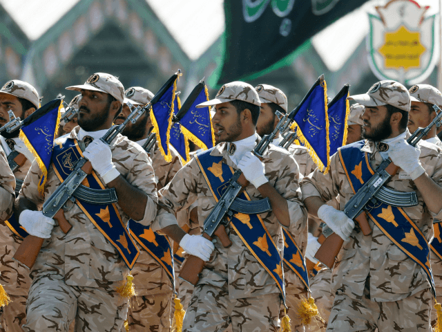 Iranian soldiers march during the annual military parade marking the anniversary of the outbreak of its devastating 1980-1988 war with Saddam Hussein's Iraq, on September 22,2017 in Tehran. President Hassan Rouhani vowed that Iran would boost its ballistic missile capabilities despite criticism from the United States and also France. / …