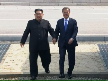 In this image taken from video provided by Korea Broadcasting System Friday, April 27, 2018, North Korean leader Kim Jong Un, left, crosses the border into South Korea, along with South Korean President Moon Jae-in for their historic face-to-face talks, in Panmunjom. Their discussions will be expected to focus on …