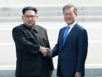 North Korean leader Kim Jong Un (L) and South Korean President Moon Jae-in (R) shake hands after Kim crossing the military demarcation line upon meeting for the Inter-Korean Summit April 27, 2018 in Panmunjom, South Korea. (Photo by Korea Summit Press Pool/Getty Images)