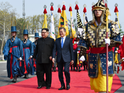 North Korean leader Kim Jong Un (L) and South Korean President Moon Jae-in (R) walk to the official welcome hall after meeting and Kim crossing the military demarcation line (MDL) for the Inter-Korean Summit on April 27, 2018 in Panmunjom, South Korea. Kim and Moon meet at the border today …
