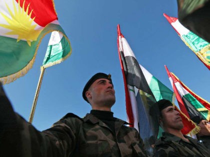 Iraqi Kurdish Peshmerga take part in a graduation ceremony at the Zakho military academy i