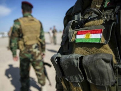 Bashiqa, Iraq - April 20: National flag of Kurdistan on a uniform of a Kurdish soldier on