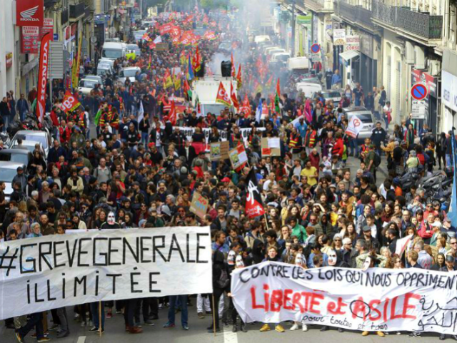 Demonstrators march during a protest against French President Emmanuel Macron’s governme