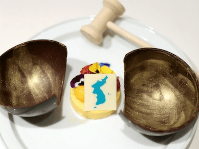 A blue unified flag of the Koreas that includes Takeshima sits atop the mango mousse to be