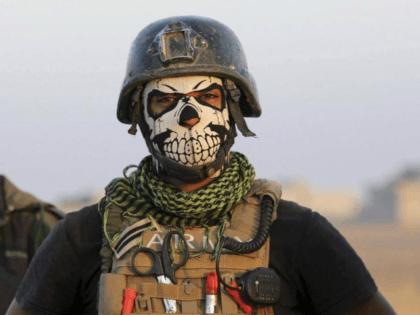 A member of Iraq's elite Special Forces wears a skull mask in the fight against the Islami