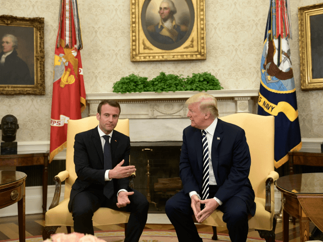 US President Donald Trump (R) and French President Emmanuel Macron speak to the media in t