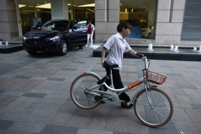 Tencent-backed Meituan buys China bike-sharing leader Mobike: reports