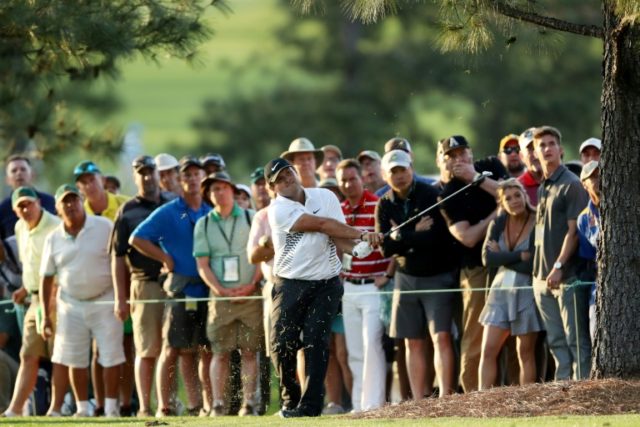 Star-studded pack chases Masters leader Reed
