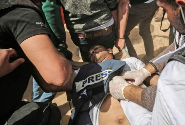 Palestinians bury their dead after Israel kills nine in border clashes