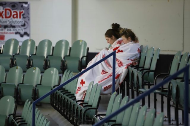 Canada town honors hockey crash victims at somber vigil
