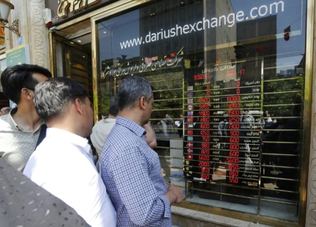 Iranians flock to empty exchangers after currency fix