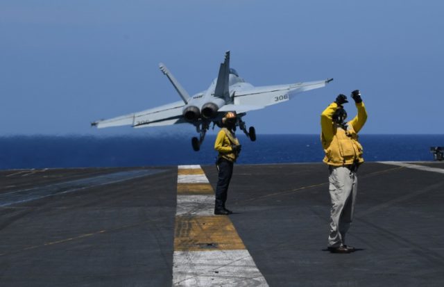 US displays military muscle as carrier sails in South China Sea