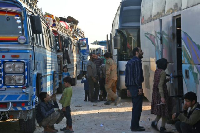 Miles from home, disillusioned Syrians say air strikes 'not enough'