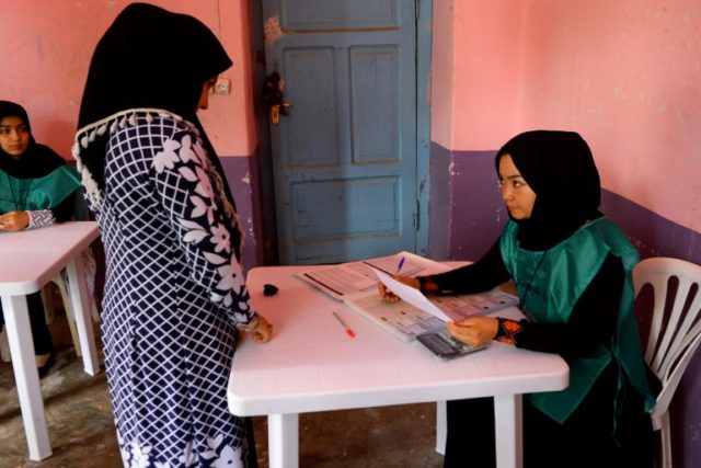 Afghans register to vote in long-delayed elections amid violence