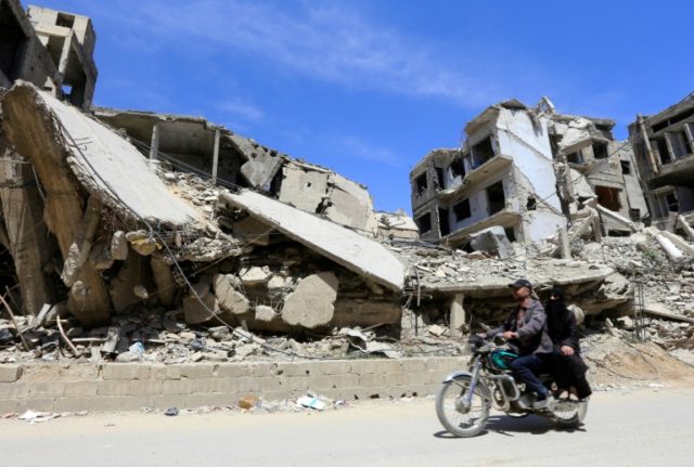 Residents of Syria's Douma breathe fresh air after weeks in hiding