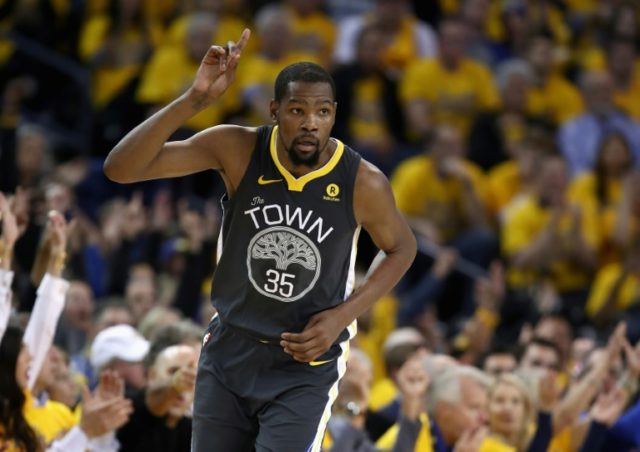 Durant, Thompson star as Warriors sink Spurs