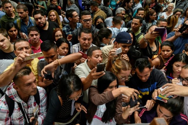 Venezuelans swarm outside Chilean consulate seeking new visa