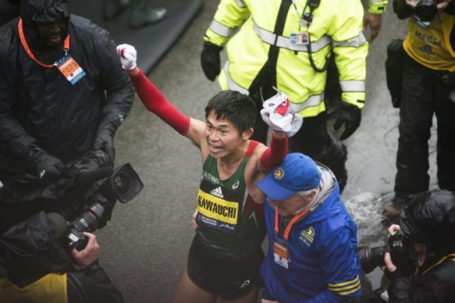 Japan hails school clerk who won Boston Marathon