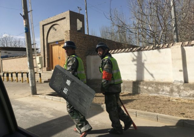 'Eradicate the tumours': Chinese civilians drive Xinjiang crackdown