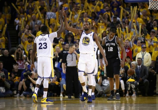 Durant steers Warriors past Spurs, Sixers advance