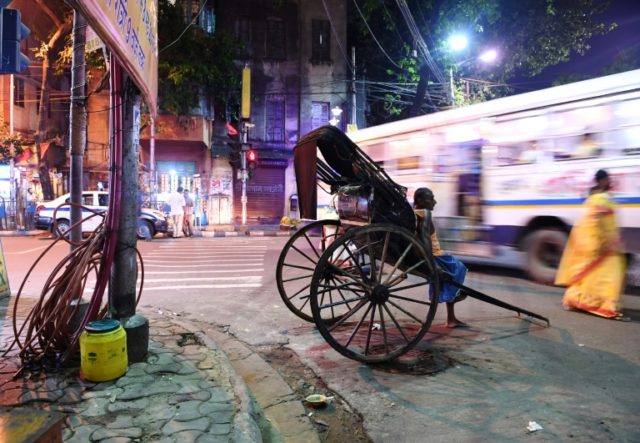 Rickshaw pullers fade from India's streets