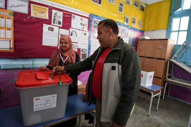 In first for Tunisia, police and soldiers head to polls
