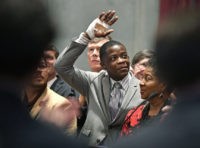 Waffle House Shooting James Shaw Jr., waves to the crowd and legislators inside the Tennessee House chambers as he is honored for disarming a shooter inside a Nashville area Waffle House at the Tennessee State House Tuesday April 24, 2018, in Nashville, Tenn. (Larry McCormack/The Tennessean via AP) The Associated Press