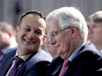 Ireland Britain Brexit EU's chief Brexit negotiator Michel Barnier, right, reacts with Ireland's Prime Minister Leo Varadkar, during a media presentation during the All Ireland Civic Dialogue conference on Brexit, in Dundalk, Ireland, Monday April 30, 2018. Barnier is conducting two days of talks about Britain's split with the European Union, Brexit, to assess the situation on both sides of the border between northern and southern Ireland. (Niall Carson/PA via AP) UK government suffers Brexit defeat in House of Lords