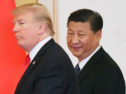 File photo taken in November 2017 shows U.S. President Donald Trump (L) and Chinese Presid