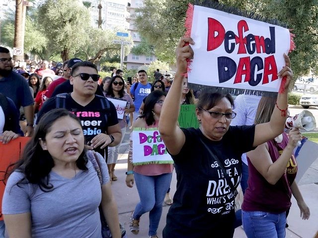 DACA supporters march to the Immigration and Customs Enforcement office to protest shortly after U.S. Attorney General Jeff Sessions' announcement that the Deferred Action for Childhood Arrivals (DACA), will be suspended with a six-month delay, Tuesday, Sept. 5, 2017, in Phoenix. President Donald Trump on Tuesday began dismantling the Deferred …