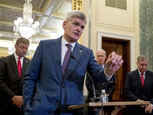 From left, Sen. Dean Heller, R-Nev., Sen. Bill Cassidy, R-La., Sen. Ron Johnson, R-Wis., and Sen. Lindsey Graham, R-S.C., hold a press conference on Capitol Hill in Washington, Wednesday, Sept. 13, 2017, to unveil legislation to reform health care. (AP Photo/Andrew Harnik)