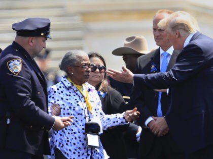 President Donald Trump greets Adrianna Valoy, the mother of New York Police Department det