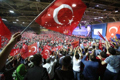 People wave Turkish flags, in Sarajevo, Bosnia, on Sunday, May 20, 2018. Turkey's presiden