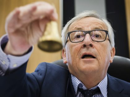 EU Commission President Jean-Claude Juncker rings the bell as he opens the college of commissioners at EU headquarters in Brussels, Wednesday, May 23, 2018.