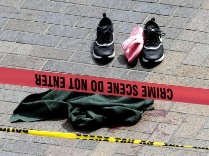 traffic - Clothing is strewn on the sidewalk at a scene where pedestrians were hit by a mo