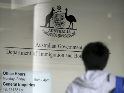 A man arrives at the Department of Immigration and Border Protection offices in Sydney, Thursday, April 20, 2017. Australia plans to tighten its citizenship rules to require higher English language skills, longer residency and evidence of integration such as a job. (AP Photo/Rick Rycroft)