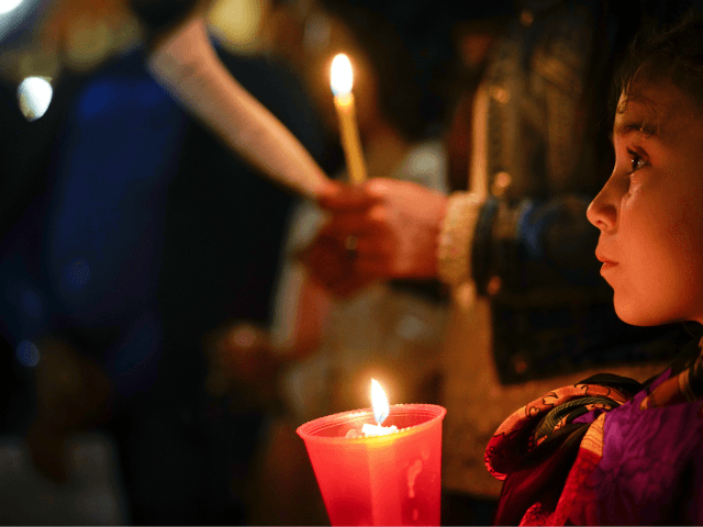 People hold candles as they attend a prayer vigil for terminally ill toddler Alfie Evans, in St. Peter's Square at the Vatican, Thursday, April 26, 2018. The British hospital treating Alfie Evans withdrew his life support Monday after a series of court rulings sided with the doctors and blocked further …