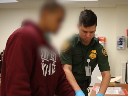 Laredo Sector Border Patrol agent processes a Bangladeshi national after he illegally cros